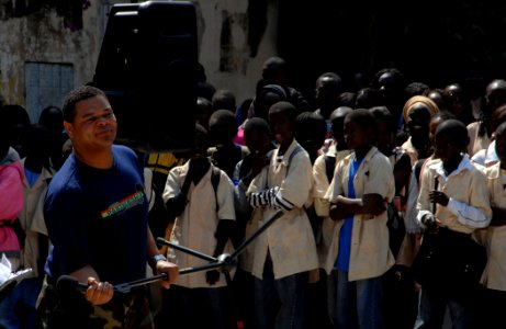US Navy 090204-N-1688B-269 Musician 2nd Class Kori Gillis sings for the students of Lycee Abdoulaye during his performance with the Diplomats, the Commander, U.S. Naval Forces Europe (CNE) Band and CNE subset band