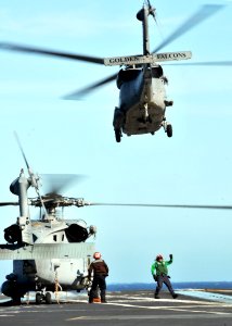 US Navy 090128-N-7981E-027 An HH-60 Sea Hawk helicopter and an SH-60F Sea Hawk helicopter are launched from the aircraft carrier USS Abraham Lincoln (CVN 72)