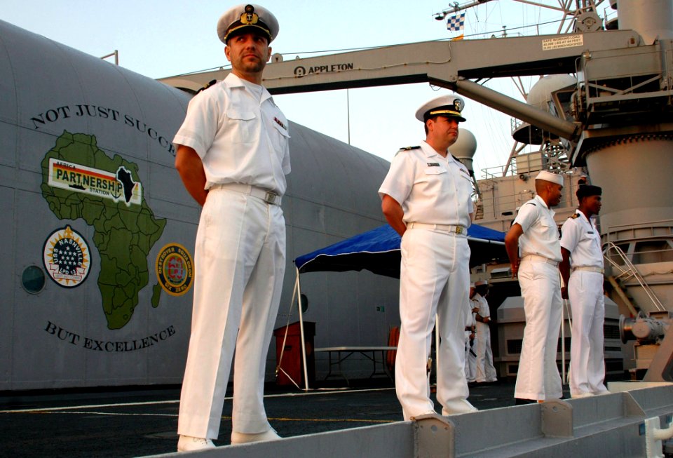 US Navy 090204-N-1655H-024 nternational Sailors man the rails of the amphibious transport dock ship USS Nashville (LPD 13)
