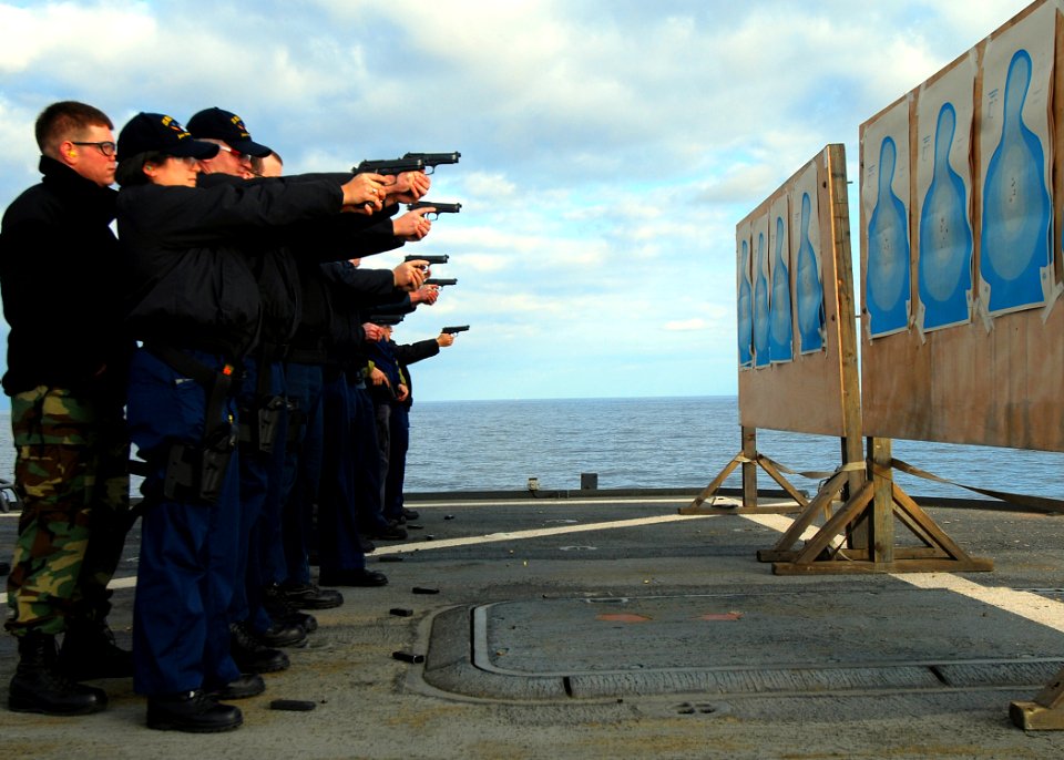 US Navy 090131-N-4044H-012 Sailors and maritime professionals aboard the amphibious command ship USS Mount Whitney (LCC 20) participate in 9mm small-arms qualifications