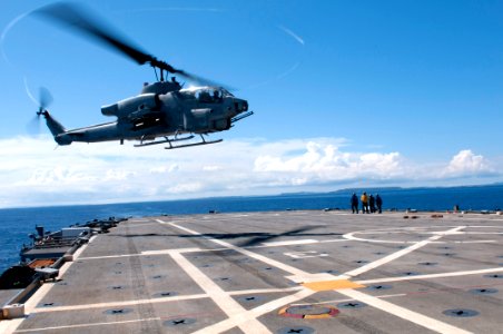 US Navy 111012-N-ER662-058 An AH-1W Super Cobra helicopter lands aboard the forward-deployed amphibious transport dock ship USS Denver (LPD 9)