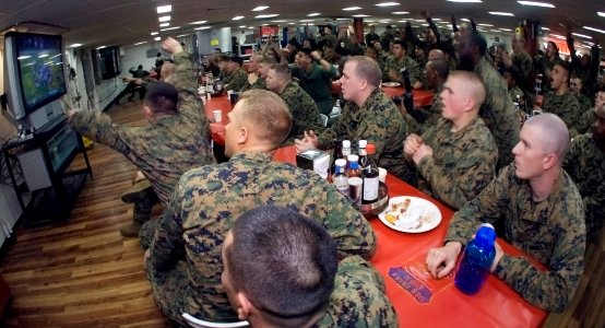 US Navy 090202-N-5253W-043 Sailors and Marines aboard the amphibious assault ship USS Essex (LHD 2) react as the Pittsburgh Steelers score against the Arizona Cardinals late in the fourth quarter of Superbowl XLIII