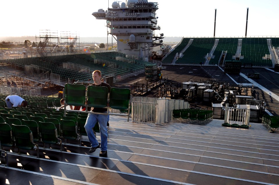 US Navy 111107-N-RG587-098 Civilian contractors install bleacher seats as workers construct a basketball arena aboard the Nimitz-class aircraft car