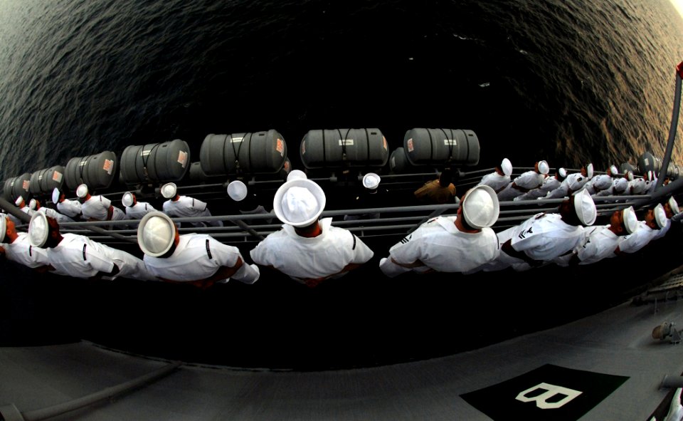 US Navy 090204-N-1688B-021 Sailors man the rails of the amphibious transport dock ship USS Nashville (LPD 13)