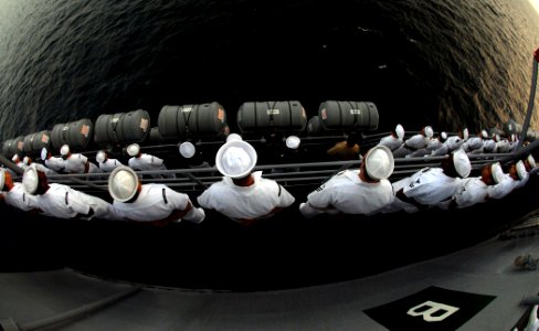 US Navy 090204-N-1688B-021 Sailors man the rails of the amphibious transport dock ship USS Nashville (LPD 13) photo