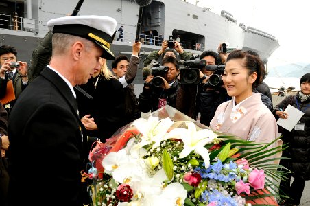 US Navy 090205-N-7280V-015 Capt. Thom W. Burke, commanding officer of the amphibious command ship USS Blue Ridge (LCC 19) is presented flowers on behalf of the Seihi-Kai Home for Senior Citizens after mooring pier side in Nagas