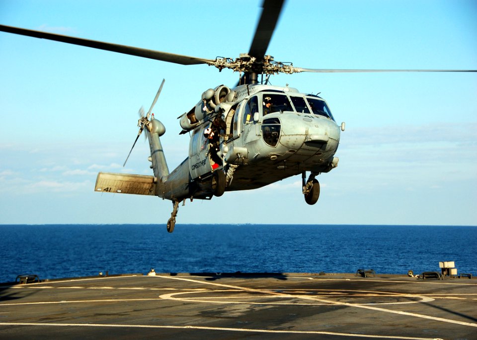 US Navy 090131-N-1429M-058 An MH-60 Sea Hawk helicopter assigned to Helicopter Sea Combat Squadron (HSC) 28 lands aboard the amphibious command ship USS Mount Whitney (LCC 20)