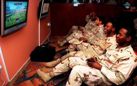US Navy 090205-N-7862M-002 Sailors play video games at the newly-renovated Liberty Center at Naval Support Activity Bahrain