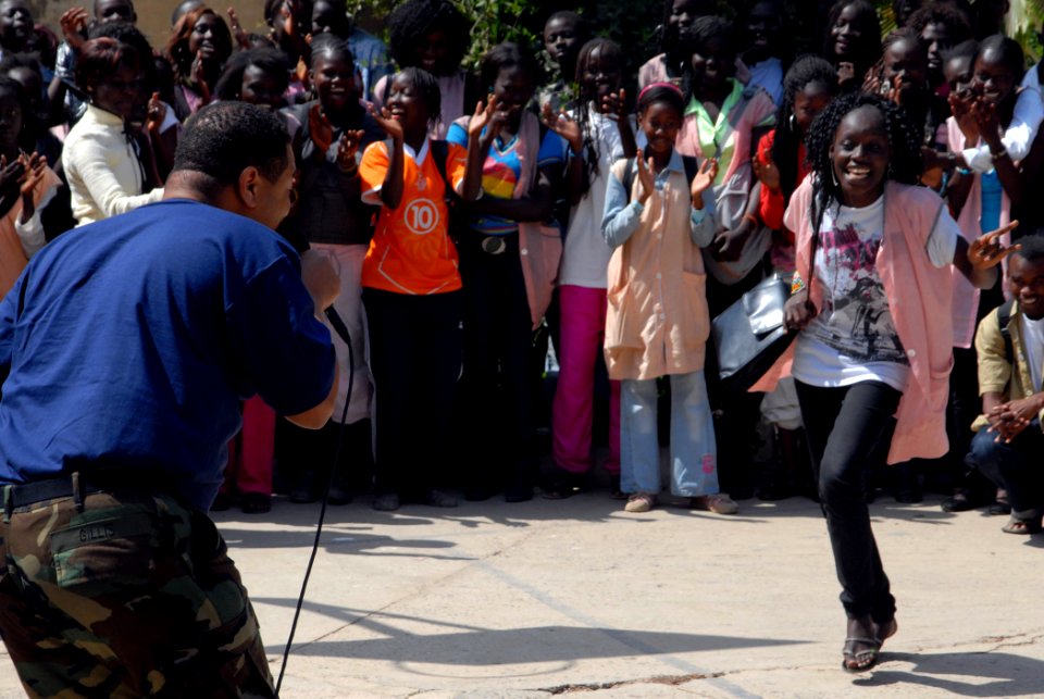 US Navy 090204-N-1688B-257 Musician 2nd Class Kori Gillis sings for the students of Lycee Abdoulaye