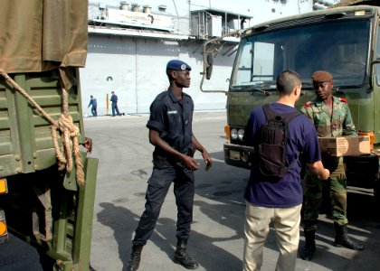 US Navy 090206-N-1655H-349 Sailors assigned to the amphibious transport dock USS Nashville (LPD 13) and Senegalese military personnel load trucks with donated items from Project Handclasp during an Africa Partnership Station co photo