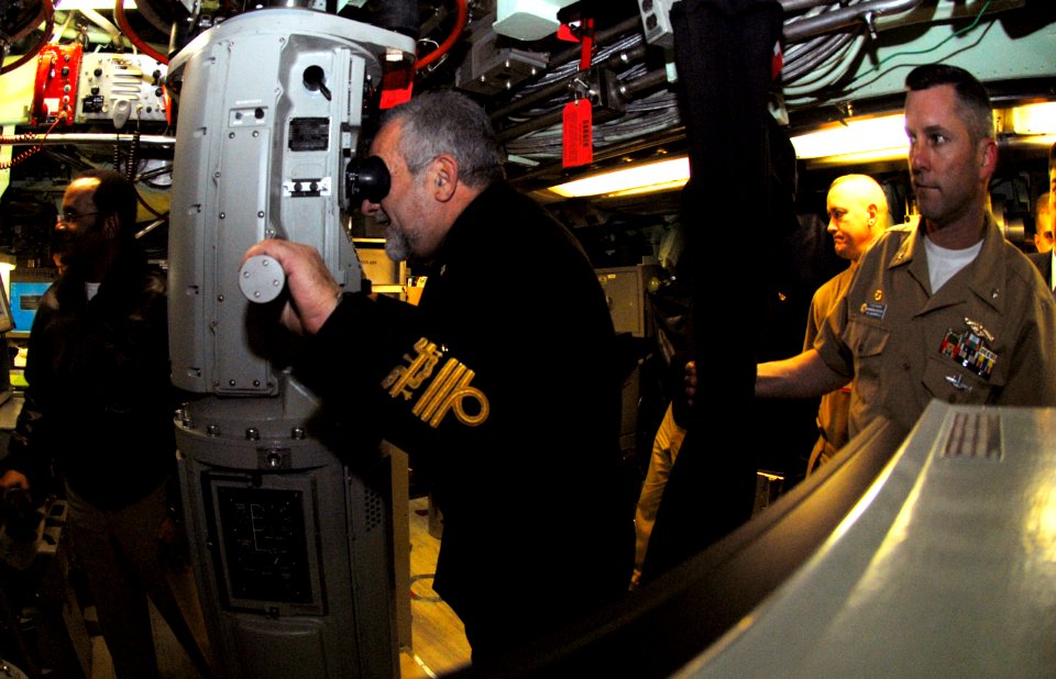 US Navy 090204-N-7705S-017 Vice Adm. Giuseppe Lertora, Commander in Chief of the Italian Fleet, peers through the periscope of the Los Angeles-class attack submarine USS Jacksonville (SSN 699)