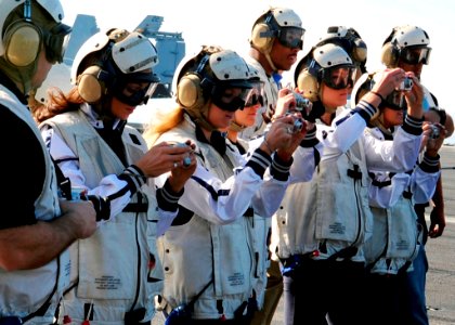 US Navy 090201-N-8822R-034 Players and cheerleaders from the NFL football team the New England Patriots observe flight operations aboard the aircraft carrier USS Theodore Roosevelt (CVN 71)