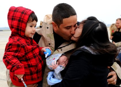 US Navy 111104-N-FJ200-047 Sailor greets his family after deployment