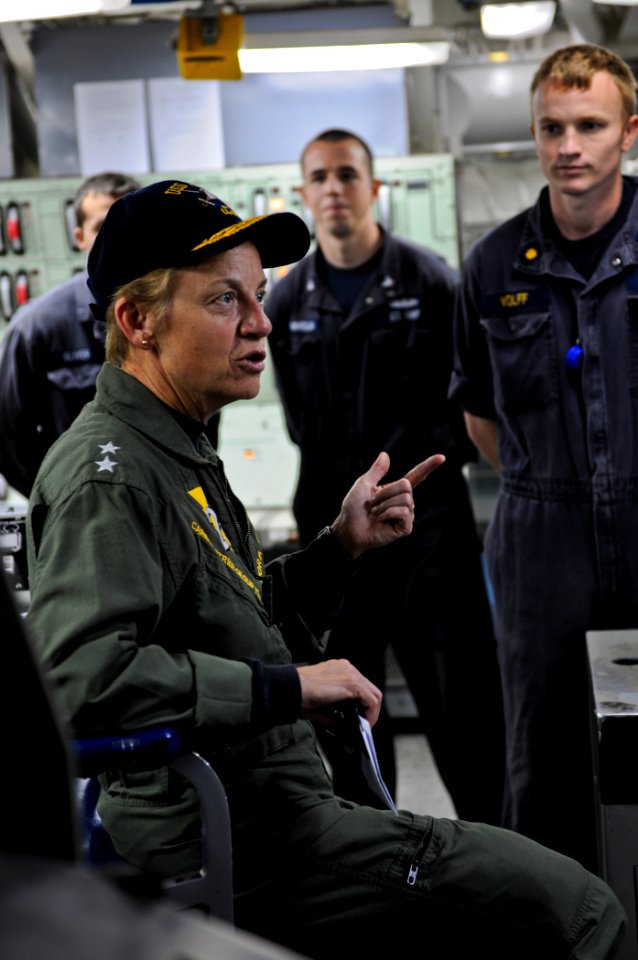 US Navy 111122-N-YM590-075 Rear Adm. Nora W. Tyson, commander of Carrier Strike Group (CSG) 2, left, speaks with Sailors in the central control sta