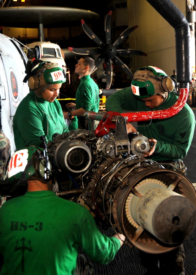 US Navy 090204-N-2562S-008 Aviation Machinist's Mate 1st Class Sandra Lay,Aviation Electrician's Mate Joe Busby, Aviation Machinist's Mate 3rd Class Jose Arriola and Aviation Machinist's Mate 3rd Class Justin Brown inspect the