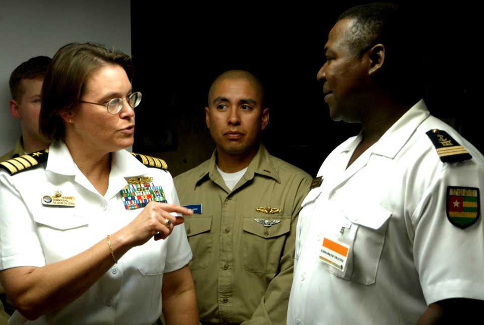 US Navy 090205-N-3316L-028 Capt. Cindy Thebaud, commanding officer of Africa Partnership Station speaks with an embarked trainee during a shipboard indoctrination class aboard the amphibious transport dock ship USS Nashville (L