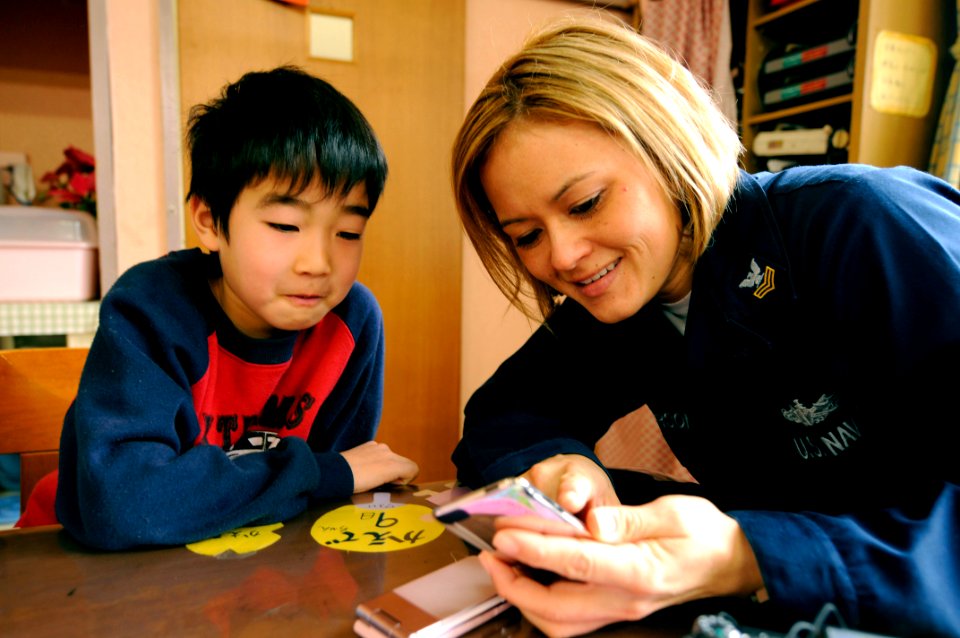 US Navy 090207-N-8546L-127 Cryptologic Technician (Networks) 1st Class Christine Anderson, assigned to Commander, U.S. 7th Fleet staff and embarked aboard the amphibious command ship USS Blue Ridge (LCC 19), shows her MP3 playe