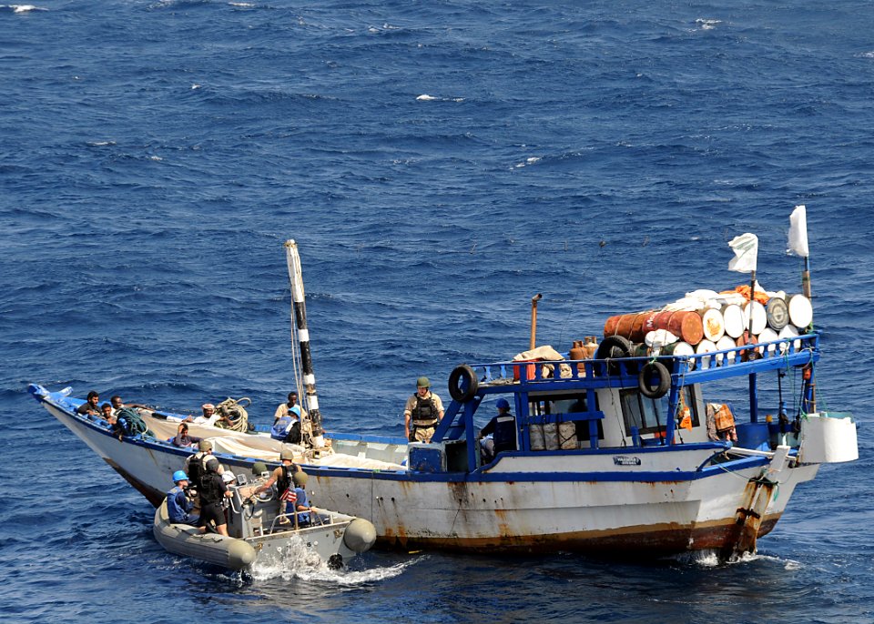 US Navy 090207-N-1082Z-056 Sailors assigned to the guided-missile cruiser USS Vella Gulf (CG 72) render assistance to fishermen aboard a dhow