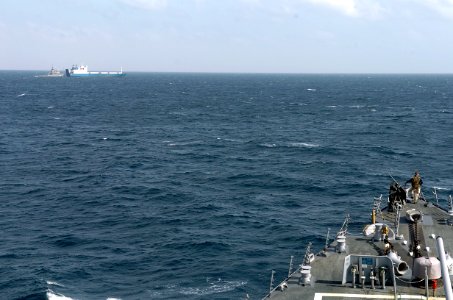 US Navy 090206-N-3931M-158 A watch stander on the bow of USS Mahan (DDG 87) monitors the fleet ocean tug USNS Catawba (T-ATF 168) as it makes preparations to transfer provides fuel and fresh water to Motor Vessel Faina photo