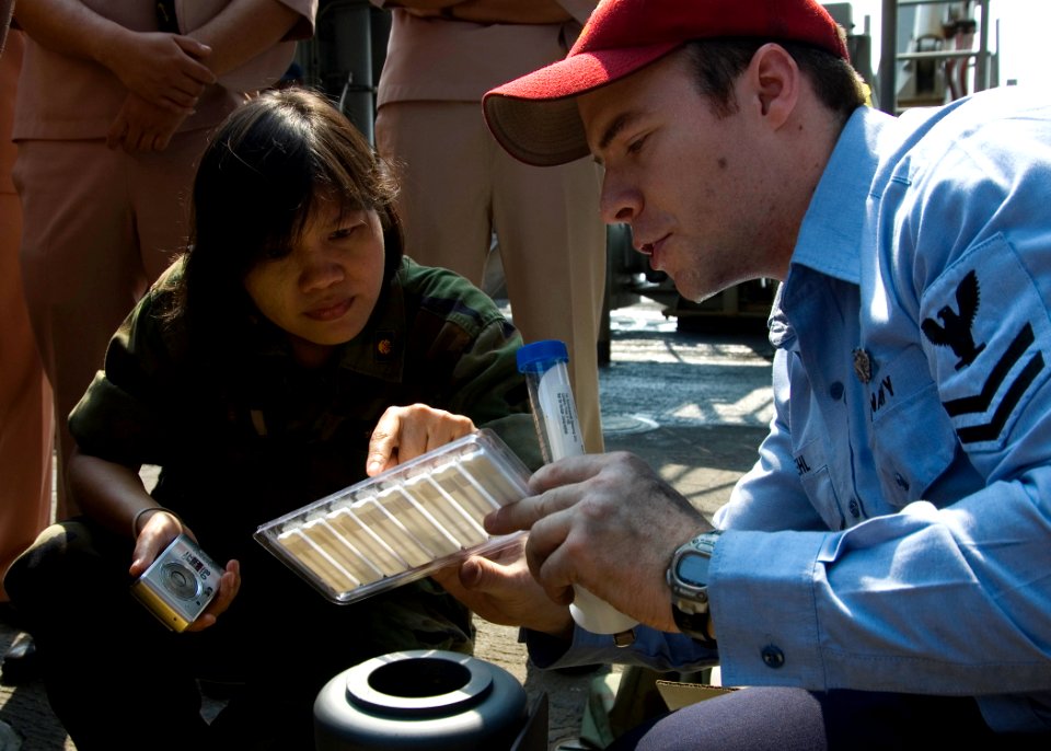 US Navy 090209-N-1251W-047 Damage Controlman 2nd Class Max Kehl, assigned to the amphibious dock landing ship USS Harpers Ferry (LSD 49) explains chemical, biological, and radiological (CBR) detection procedures to Lt. Cmdr. Ra