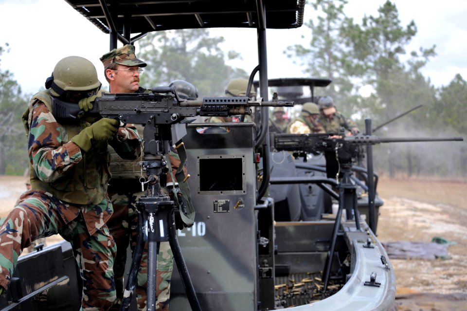 US Navy 090209-N-4205W-003 Barbados Coast Guard Petty Officer 3rd Class Stephen Cox fires an M240B .762 mm machine gun