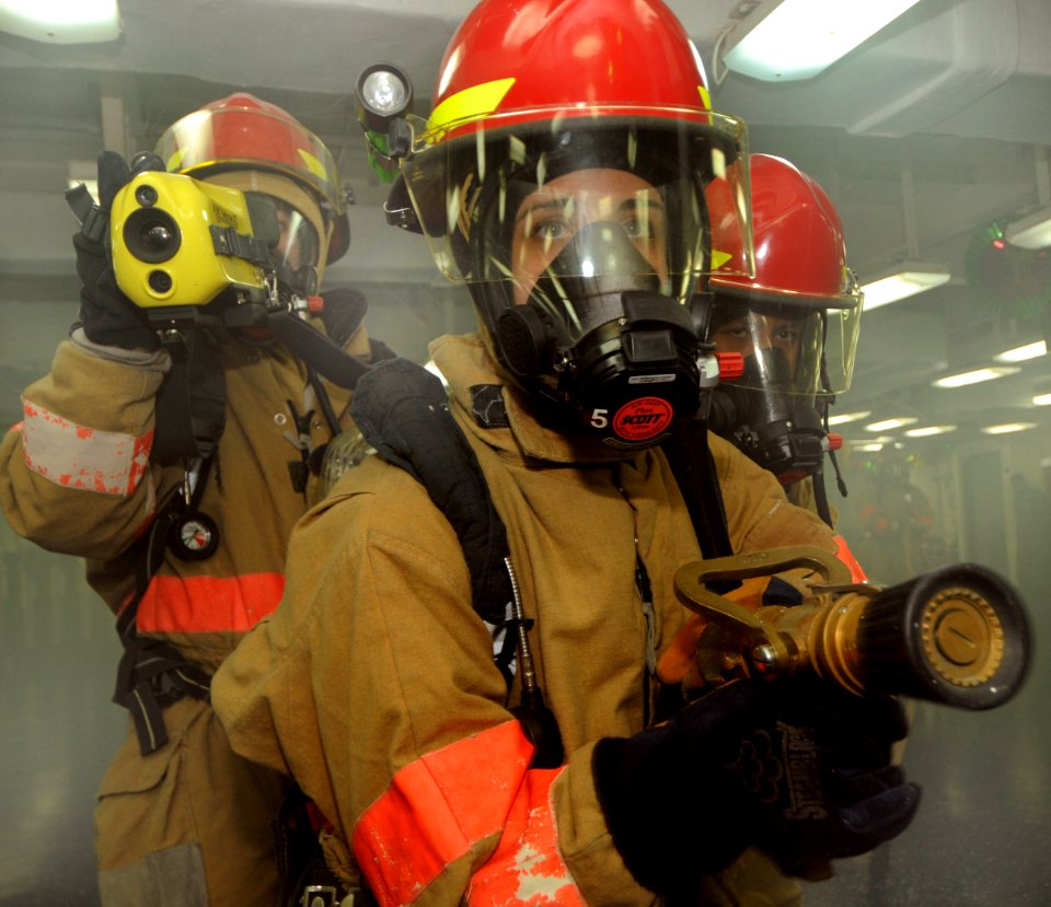 US Navy 111215-N-KA046-100 Sailors fight a mock fire during a general quarters drill