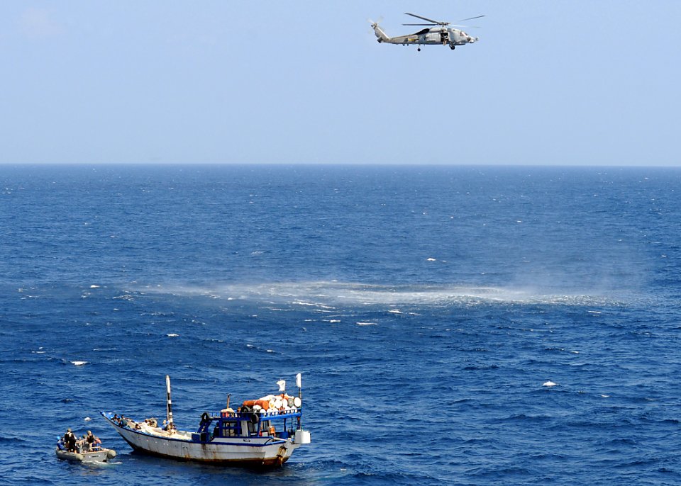US Navy 090207-N-1082Z-058 Sailors assigned to the guided-missile cruiser USS Vella Gulf (CG 72) use a rigid-hulled inflatable boat to approach a dhow needing assistance