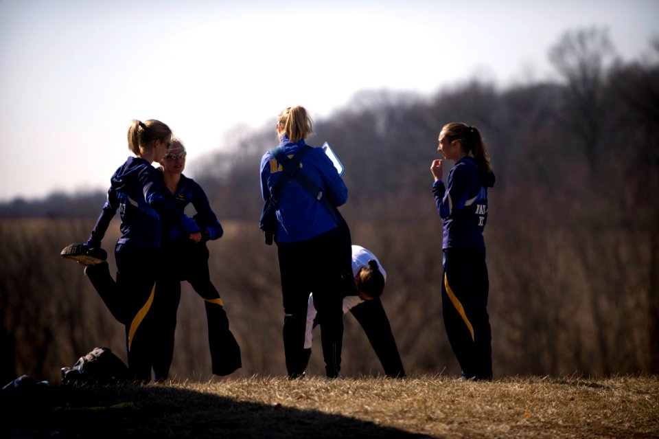 US Navy 090207-N-7090S-018 Women runners of the all-Navy cross country team come up with a last-minute game plan prior to the 8 Kilometer run during the Armed Forces Cross Country Championship