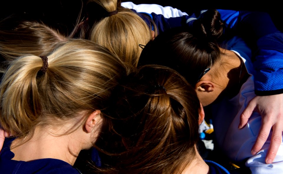 US Navy 090207-N-7090S-032 The women's all-Navy cross country team hold a team prayer prior to their 8 Kilometer run during the Armed Forces Cross-Country Championship