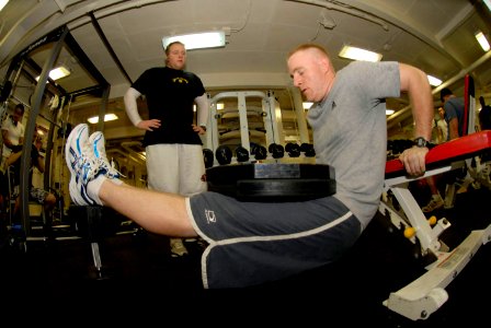 US Navy 090212-N-2475A-005 Machinist's Mate 2nd Class John Brechwald, from San Jose, Calif., performs bench dips with two 45 lb weights