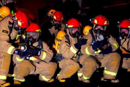US Navy 090211-N-6597H-098 Sailors combat a simulated fire during a general quarters drill aboard the Nimitz-class aircraft carrier USS John C. Stennis (CVN 74)