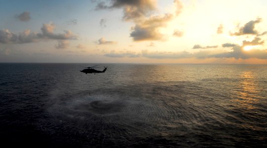 US Navy 090210-N-6538W-180 An MH-60R Sea Hawk helicopter hovers while deploying its sonar dipping buoy during an undersea warfare exercise