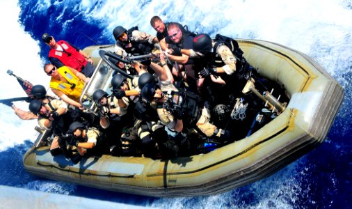 US Navy 090213-N-4774B-052 Members of a visit, board, search and seizure (VBSS) team from the guided-missile cruiser USS Lake Champlain (CG 57) pull alongside the guided-missile destroyer USS The Sullivans (DDG 68) during a VBS photo