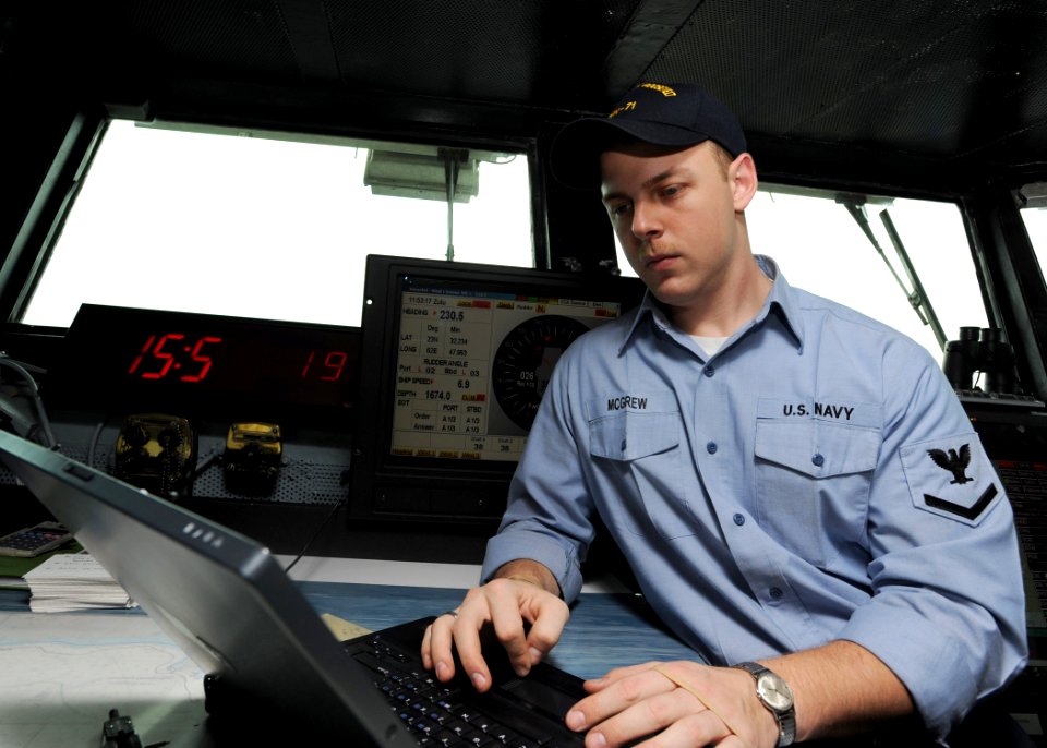 US Navy 090212-N-2908M-001 Quartermaster 3rd Class Christopher McGrew enters a deck log entry aboard the aircraft carrier USS Theodore Roosevelt (CVN 71)
