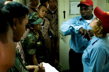 US Navy 090209-N-1251W-062 Sailors demonstrate how to cut contaminated clothing