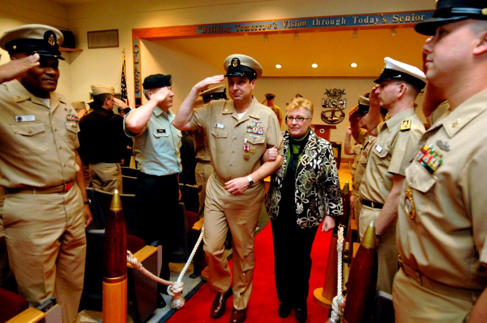 US Navy 090213-N-9818V-355 Command Master Chief James Ford and his wife, Cindy, are piped ashore after his Change of Office and Retirement Ceremony
