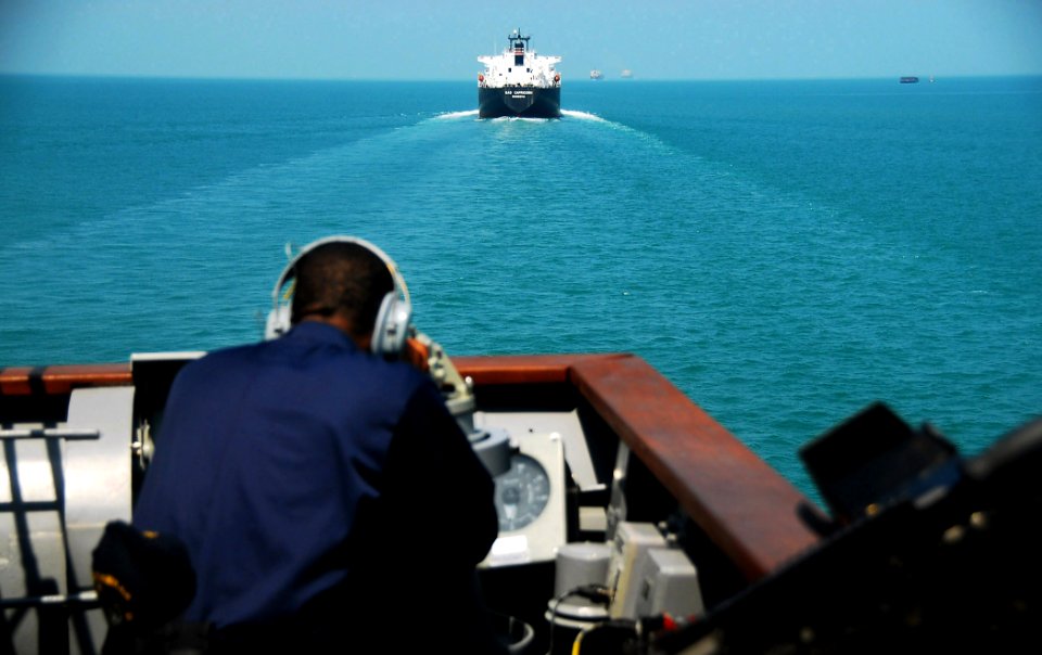 US Navy 090210-N-4774B-072 A Sailor standing watch aboard the guided-missile cruiser USS Lake Champlain (CG 57) observes boat traffic while transiting the Straits of Malacca