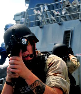 US Navy 090213-N-4774B-073 Members of a visit, board, search, and seizure team from the guided-missile cruiser USS Lake Champlain (CG 57) maintain a security post aboard the guided-missile destroyer USS The Sullivans (DDG 68) photo