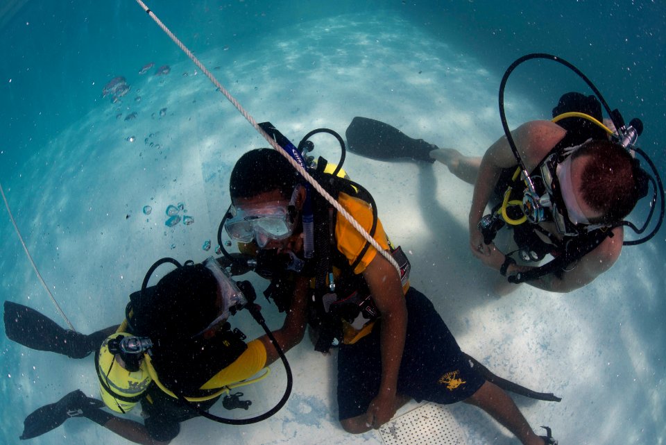 US Navy divers and Belizean Coast Guard divers practice SCUBA emergency procedures in a pool 140624-N-IP743-338