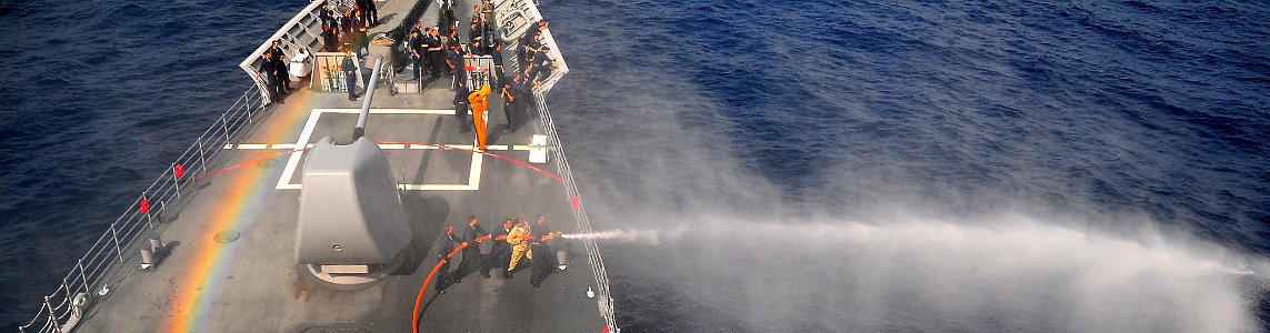 US Navy 090213-N-4774B-034 Sailors aboard the guided-missile cruiser USS Lake Champlain (CG 57) test the ship's fire hoses during a training exercise photo