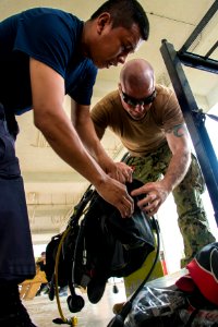 US Navy divers and Belizean Coast Guard divers work together during Southern Partnership Station '14 140611-N-IP743-138
