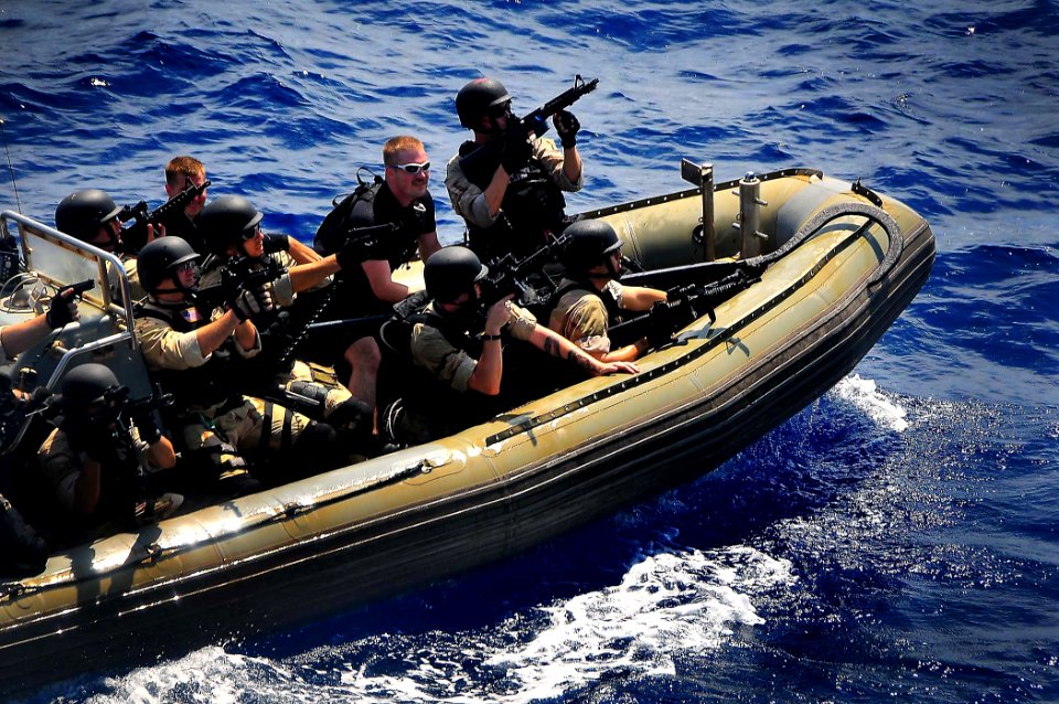 US Navy 090213-N-4774B-167 Members of a visit, board, search, and seizure team assigned to guided-missile cruiser USS Lake Champlain (CG 57) ride a rigid-hull inflatable boat at high speed during a training exercise
