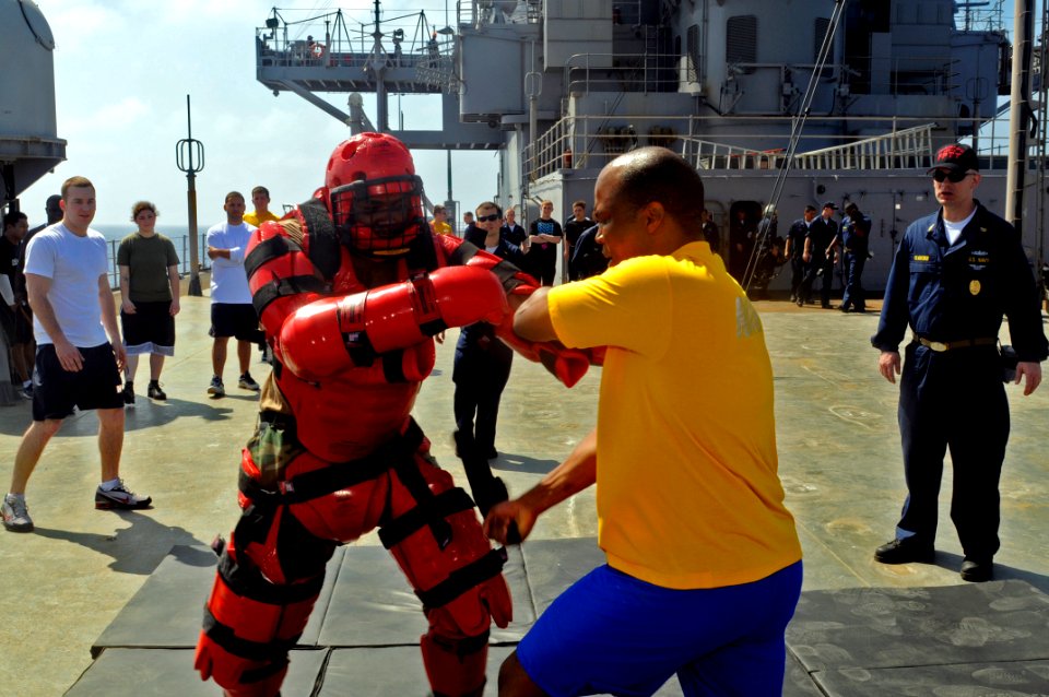 US Navy 090215-N-7280V-135 Cryptologic Technician (Maintenance) 1st Class Barry J. Harmon demonstrates a self-defense baton striking technique