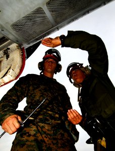 US Navy 090217-N-6538W-146 Marine Corps Lance Cpl. Braden Eichten d Marine Corps Cpl. Jay Huh nsert 9-barrel nuts while performing maintenance on an F-A-18C Hornet