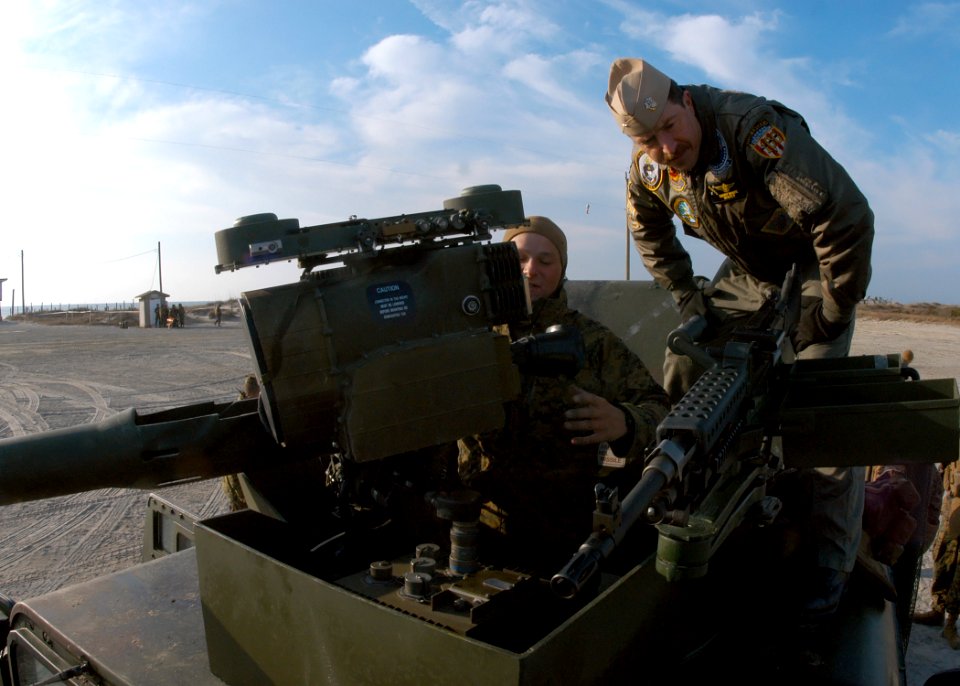 US Navy 090215-N-2636M-051 Lance Cpl. Carman Williams shows Rear Adm. Gary White a humvee's weapons system