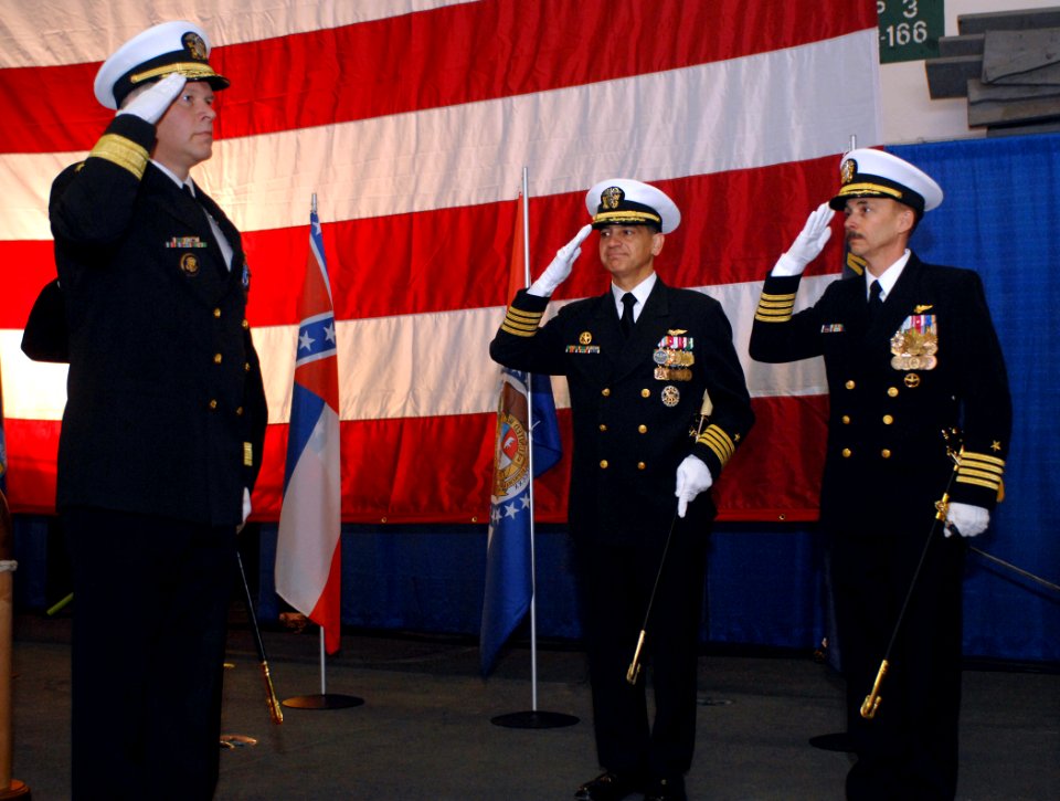 US Navy 090218-N-2984R-042 Capt. Joseph Clarkson and Capt. Herm Shelanski salute Rear Adm. (sel) Mark Fox