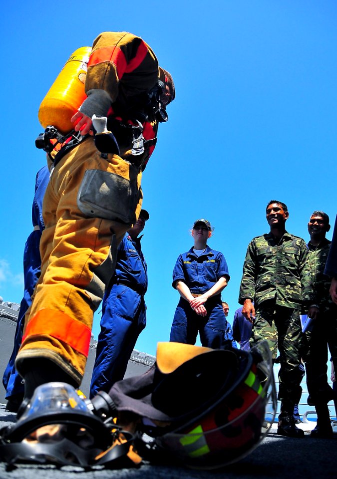 US Navy 090218-N-4774B-023 A Sailor demonstrates fire fighting equipment for members of the Maldives National Defense Force Coast Guard