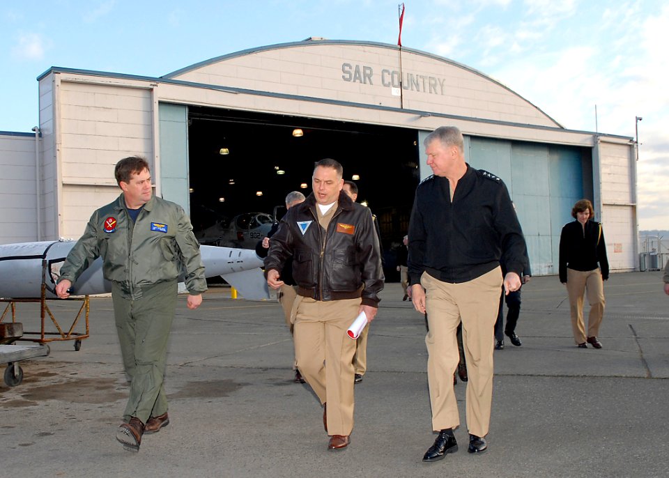 US Navy 090218-N-9860Y-003 Chief of Naval Operations (CNO) Adm. Gary Roughead walks across the flight line with Capt. Brad Russell and Capt. Chris Shay at Naval Air Station Whidbey Island
