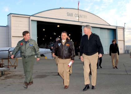 US Navy 090218-N-9860Y-003 Chief of Naval Operations (CNO) Adm. Gary Roughead walks across the flight line with Capt. Brad Russell and Capt. Chris Shay at Naval Air Station Whidbey Island