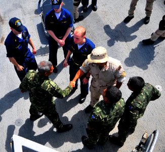 US Navy 090218-N-4774B-031 Members of the Maldives National Defense Force Coast Guard meet with the visit, board, search and seizure team from USS Lake Champlain (CG 57)